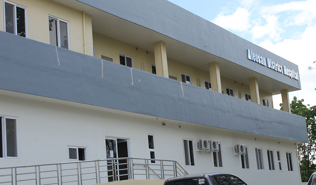 Aleosan District Hospital building photograph; not evidence of current solar operation